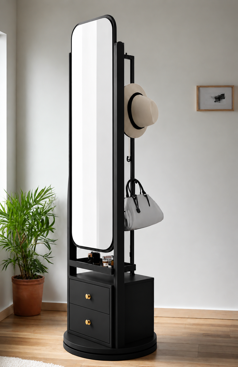 Black standing mirror with drawers and a hat and bag on display in a room.