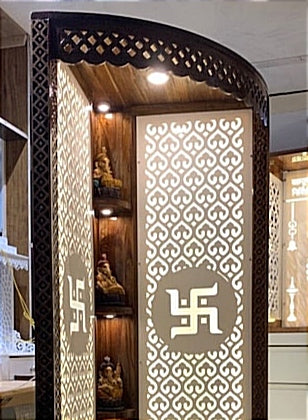 Handcrafted wooden Pooja temple with laser-cut panel, LED backlighting, and built-in deity shelves for an elegant home worship space.