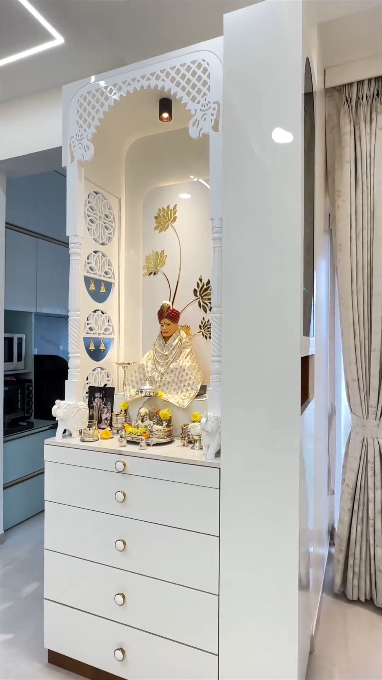 Luxury white wooden Pooja temple with gold floral detailing, side cutwork panels, and intricate dome carvings – ideal for a peaceful and stylish home mandir.