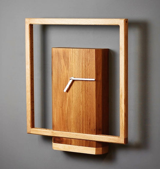 Modern Wooden Wall Clock Features A Unique design with A Natural oak Finish and a Minimalist Square Frame Surrounding a Rectangular Block